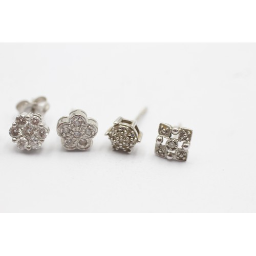 1124 - Six 9ct white gold diamond cluster unpaired single earrings - approx. gross weight 4.1 grams