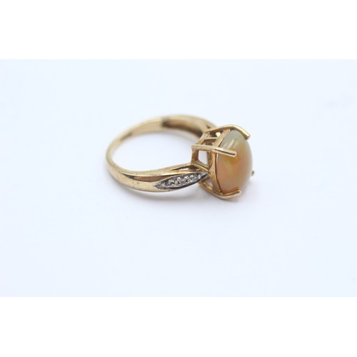 1128 - A 9ct gold opal single stone ring with white gemstone set shank - approx. gross weight 3.1 grams