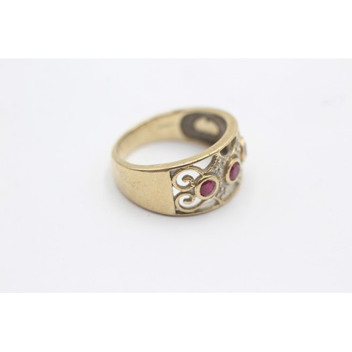 1135 - A 9ct gold diamond and ruby dress ring - approx. gross weight 3.5 grams