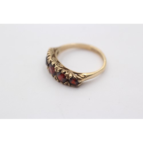 1137 - A 9ct gold garnet five stone ring, size M½ - approx. gross weight 3 grams