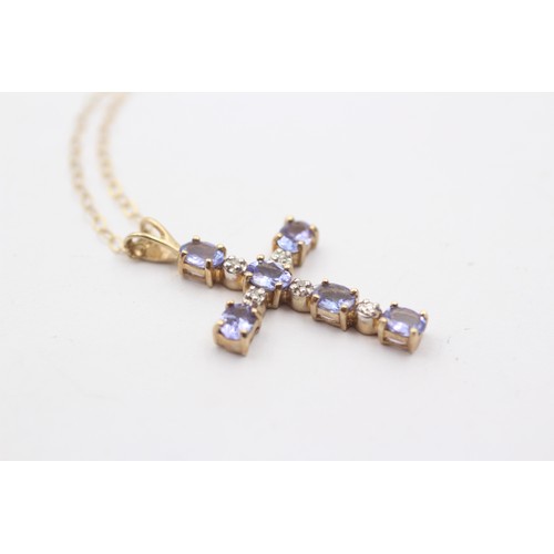 1147 - A 9ct gold diamond and tanzanite cross pendant necklace - approx. gross weight 1.7 grams