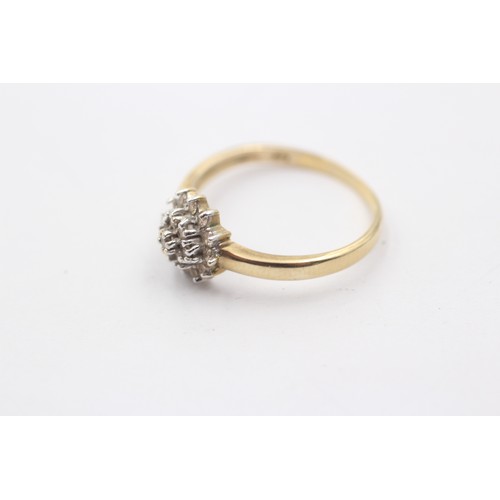 1149 - A 9ct gold diamond halo ring - approx. gross weight 1.8 grams