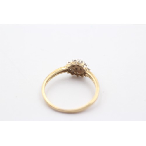 1149 - A 9ct gold diamond halo ring - approx. gross weight 1.8 grams