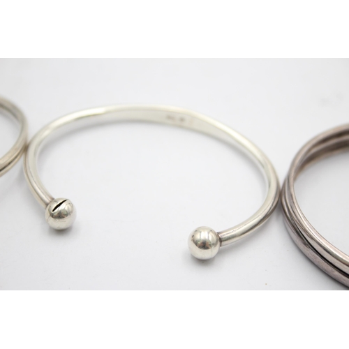 1153 - Three .925 silver bangles to include Minimalist etc. - approx. gross weight 63 grams