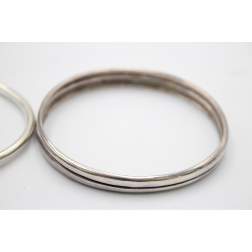 1153 - Three .925 silver bangles to include Minimalist etc. - approx. gross weight 63 grams