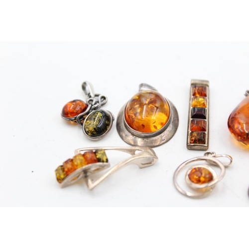 1159 - Eight .925 silver amber set pendants - approx. gross weight 46 grams