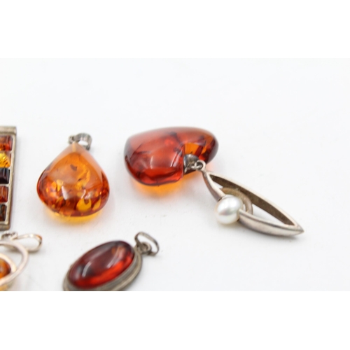 1159 - Eight .925 silver amber set pendants - approx. gross weight 46 grams