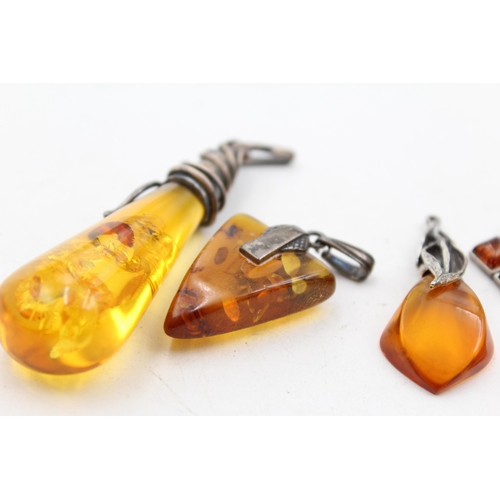 1178 - Six .925 silver amber set pendants - approx. gross weight 28 grams