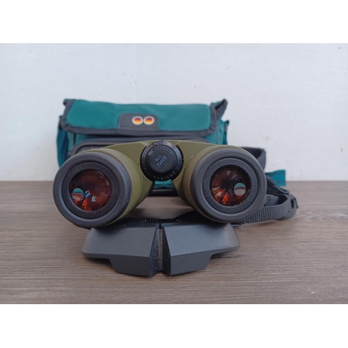 557 - A cased pair of Austrian Swarovski Optik SLC 7 x 42B binoculars