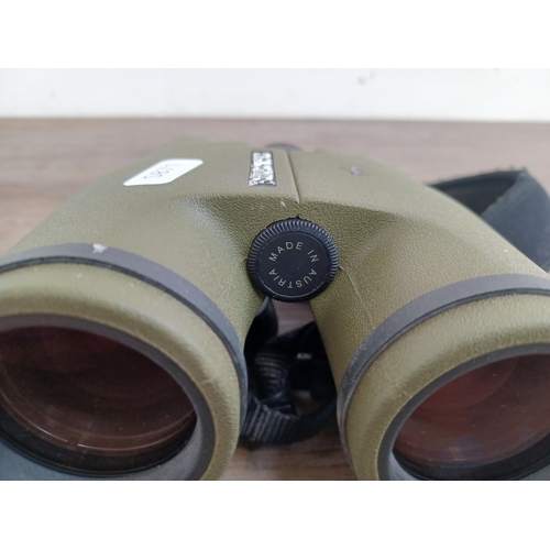 557 - A cased pair of Austrian Swarovski Optik SLC 7 x 42B binoculars