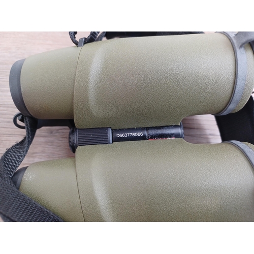 557 - A cased pair of Austrian Swarovski Optik SLC 7 x 42B binoculars