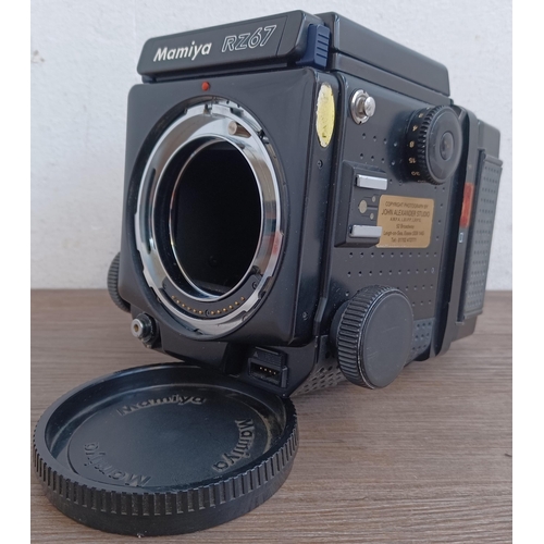 559 - A Mamiya RZ67 Professional medium format camera body fitted with film back and waist level finder