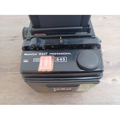 559 - A Mamiya RZ67 Professional medium format camera body fitted with film back and waist level finder