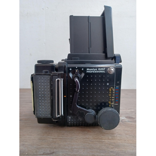 559 - A Mamiya RZ67 Professional medium format camera body fitted with film back and waist level finder