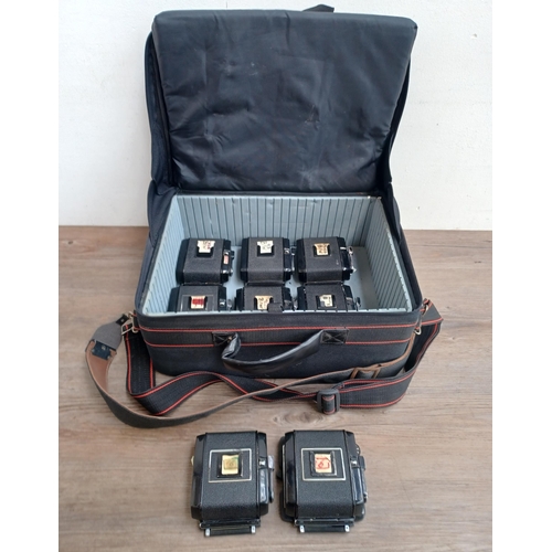 568 - A good quality Cobra case containing eight film backs