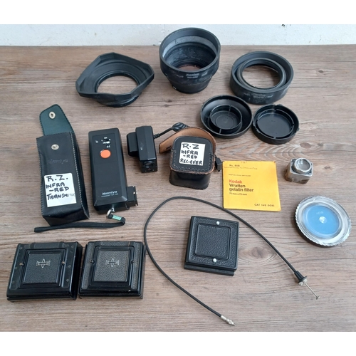 569 - Professional camera accessories and parts to include cased Mamiya MZ infra red transmitter and recei... 