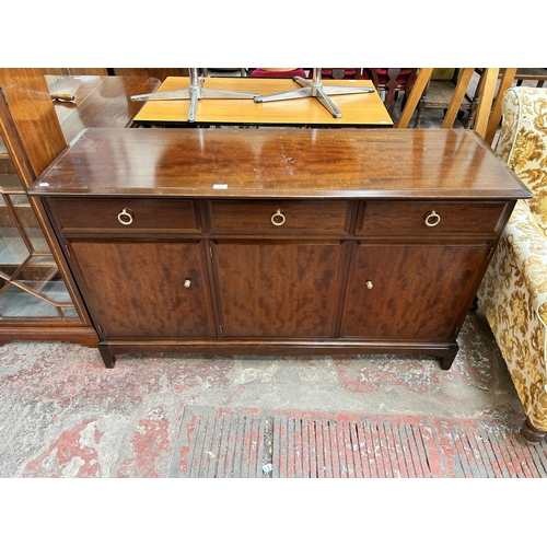 76 - A Stag Minstrel mahogany sideboard with three drawers and three cupboard doors