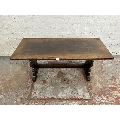 121 - A 17th century style oak rectangular twin pedestal coffee table