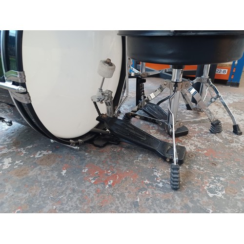 664 - A Tiger child's drum kit comprising bass drum with pedal, floor tom, two rack toms, crash and hi-hat... 