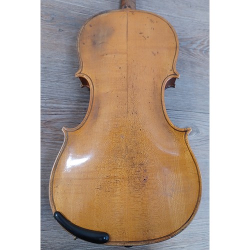 665 - A cased antique violin labelled 'Andreas Guarnerius fecit Cremonæ ſub titulo Sanctæ Teresiæ 16__' wi... 