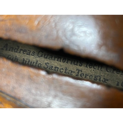 665 - A cased antique violin labelled 'Andreas Guarnerius fecit Cremonæ ſub titulo Sanctæ Teresiæ 16__' wi... 