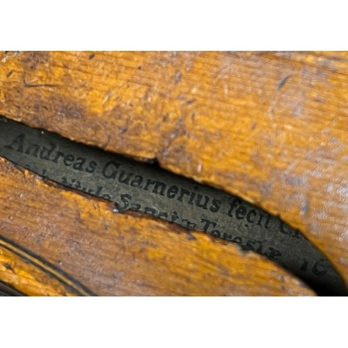 665 - A cased antique violin labelled 'Andreas Guarnerius fecit Cremonæ ſub titulo Sanctæ Teresiæ 16__' wi... 