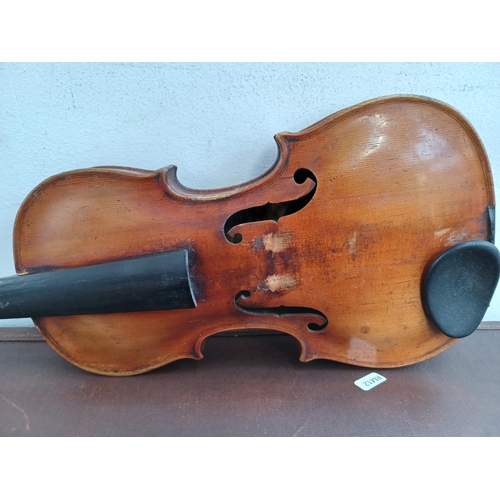 666 - A cased antique violin stamped Stainer to back with bow, tail piece and bridge