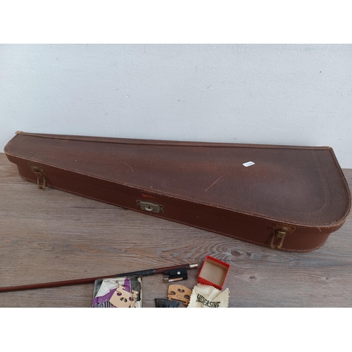 666 - A cased antique violin stamped Stainer to back with bow, tail piece and bridge