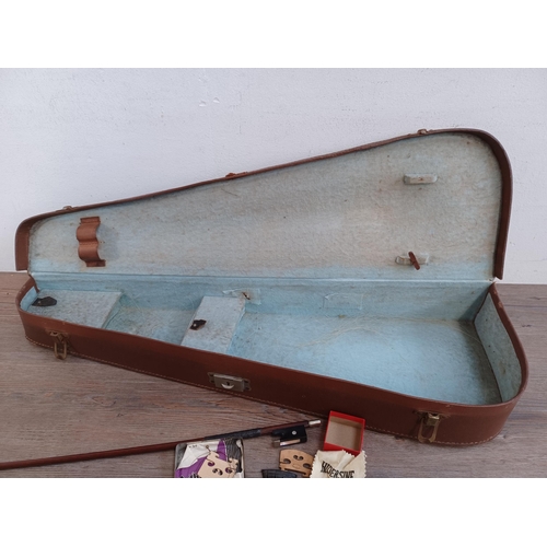 666 - A cased antique violin stamped Stainer to back with bow, tail piece and bridge