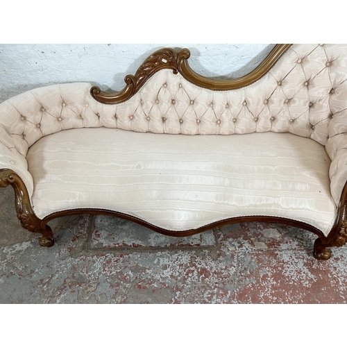 129 - A Victorian style walnut framed and fabric upholstered parlour sofa - approx. 85cm high x 203cm wide... 