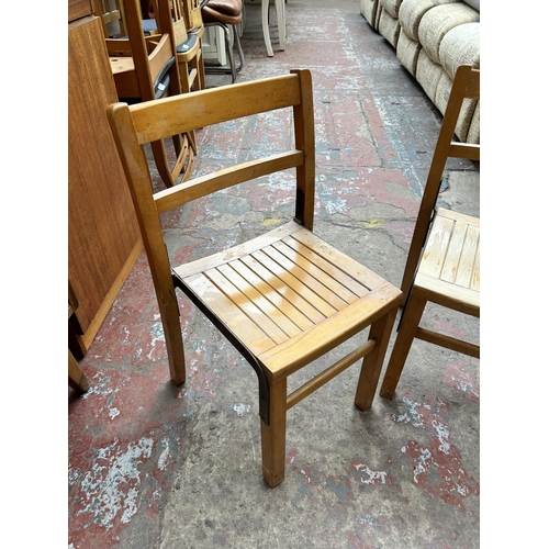 150 - A pair of mid 20th century beech child's chairs