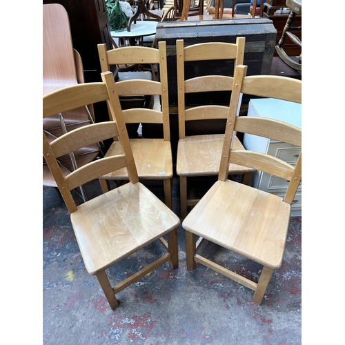 168 - A set of four modern beech ladder back dining chairs