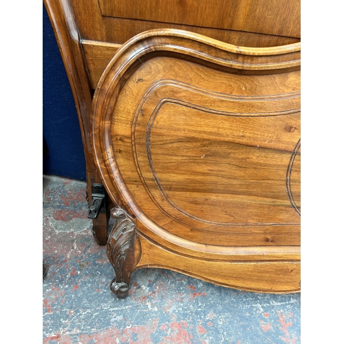 182 - A French carved walnut queen size bed frame