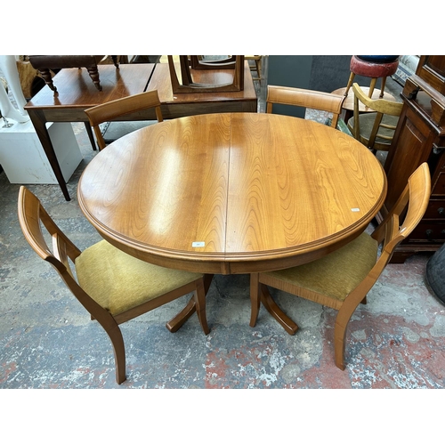 192 - A Younger teak oval extending dining table and four matching dining chairs