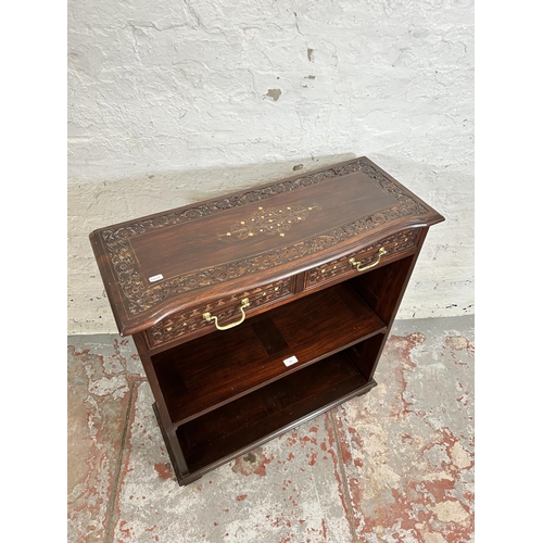 194 - An Indian brass inlaid and carved hardwood two tier open bookcase with two drawers