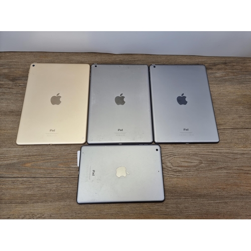 698 - Four Apple iPads to include A1489, A1474 and A1566