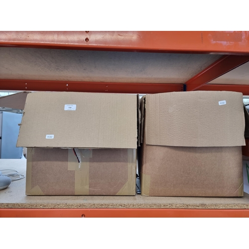 730 - Two boxes containing various landline phones and accessories