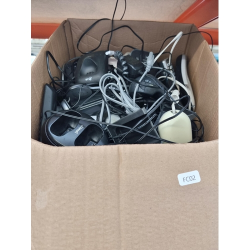 730 - Two boxes containing various landline phones and accessories