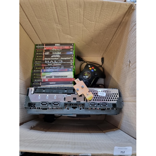 752 - A Microsoft Xbox games console with games and accessories