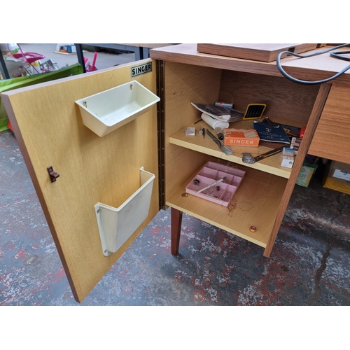 759 - A Singer sewing machine cabinet containing Singer 514 electric sewing machine with foot pedal, instr... 