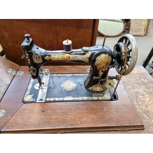 760 - A Jones Medium C.S treadle sewing machine with accessories