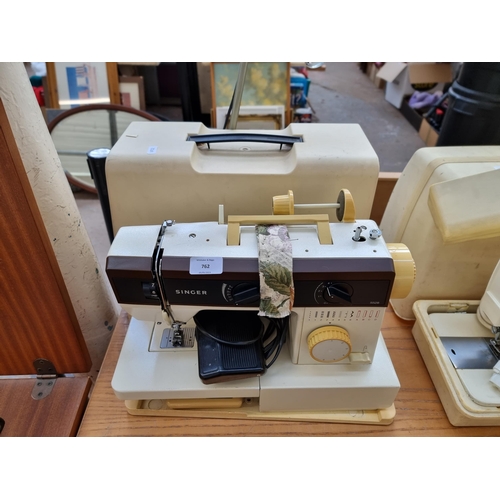 762 - A cased Singer 5528 electric sewing machine with foot pedal