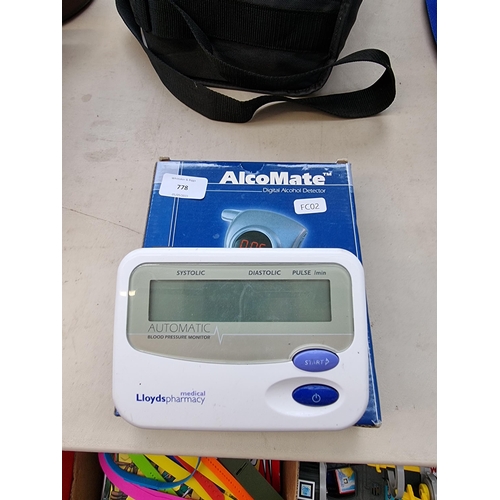 778 - Two items, one boxed AlcoMate digital alcohol detector and one fully automatic blood pressure monito... 