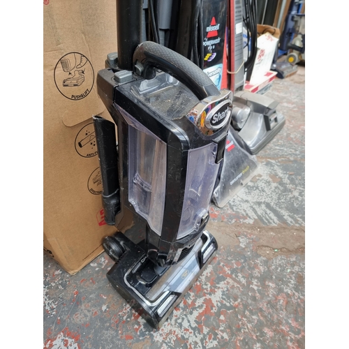 791 - A Shark upright bagless vacuum cleaner with attachments