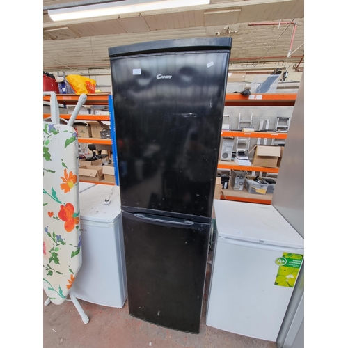 803 - Two items, one Candy upright fridge freezer approx. 174cm high and one Brabantia ironing board