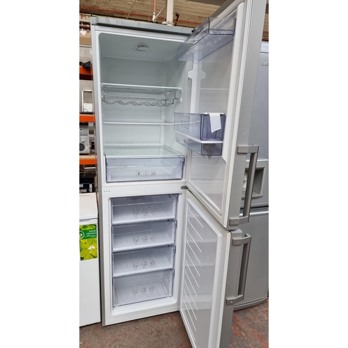 805 - A Beko upright fridge freezer with water dispenser approx.190cm high