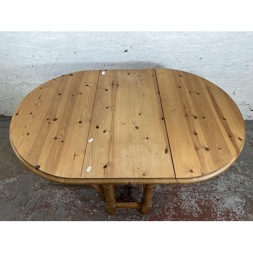 19 - A modern pine drop leaf gate leg oval dining table