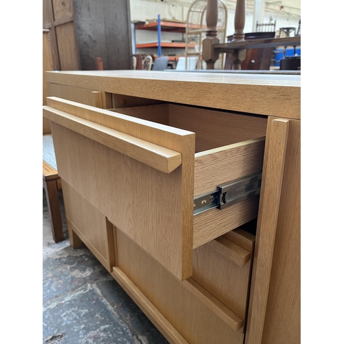 23 - A modern oak sideboard with three central drawers and two outer cupboard doors - approx. 79.5cm high... 