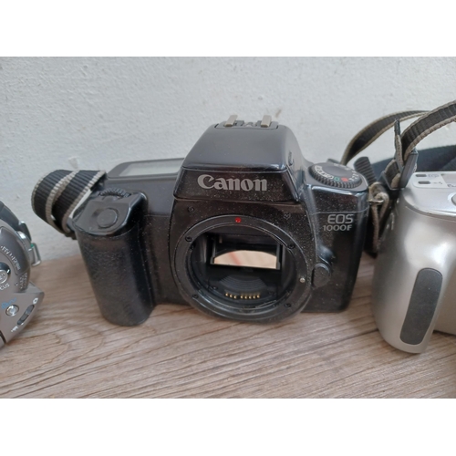 590 - Four items, one Minolta Dynax 40 35mm SLR camera, one Canon EOS 1000F 35mm SLR camera body, one Cano... 