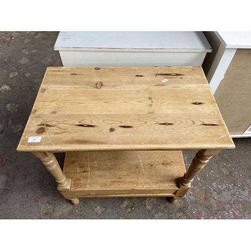 33 - A Victorian pine rectangular two tier side table with lower drawer